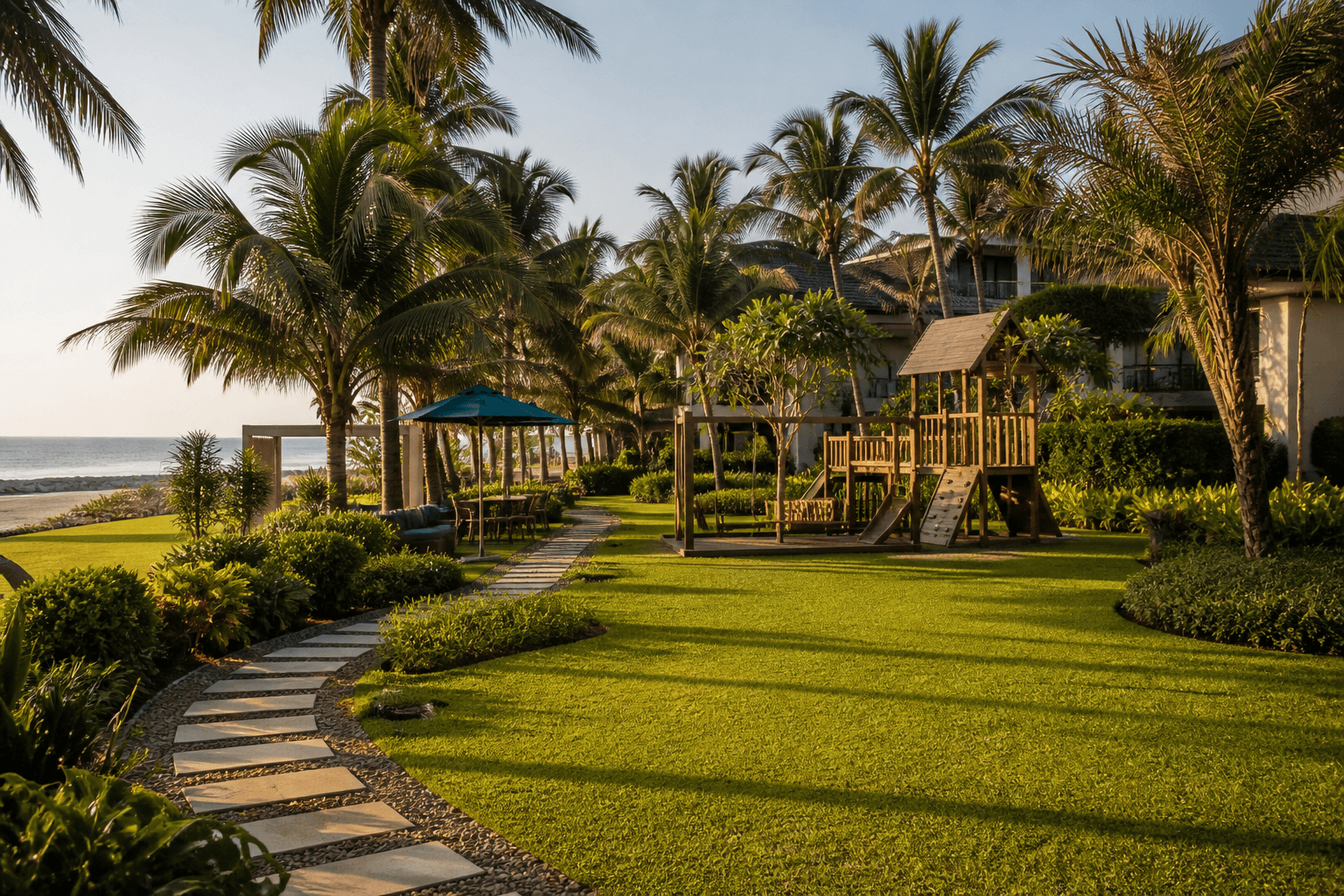 Landscaped beachfront lawn with a natural wood children's play area